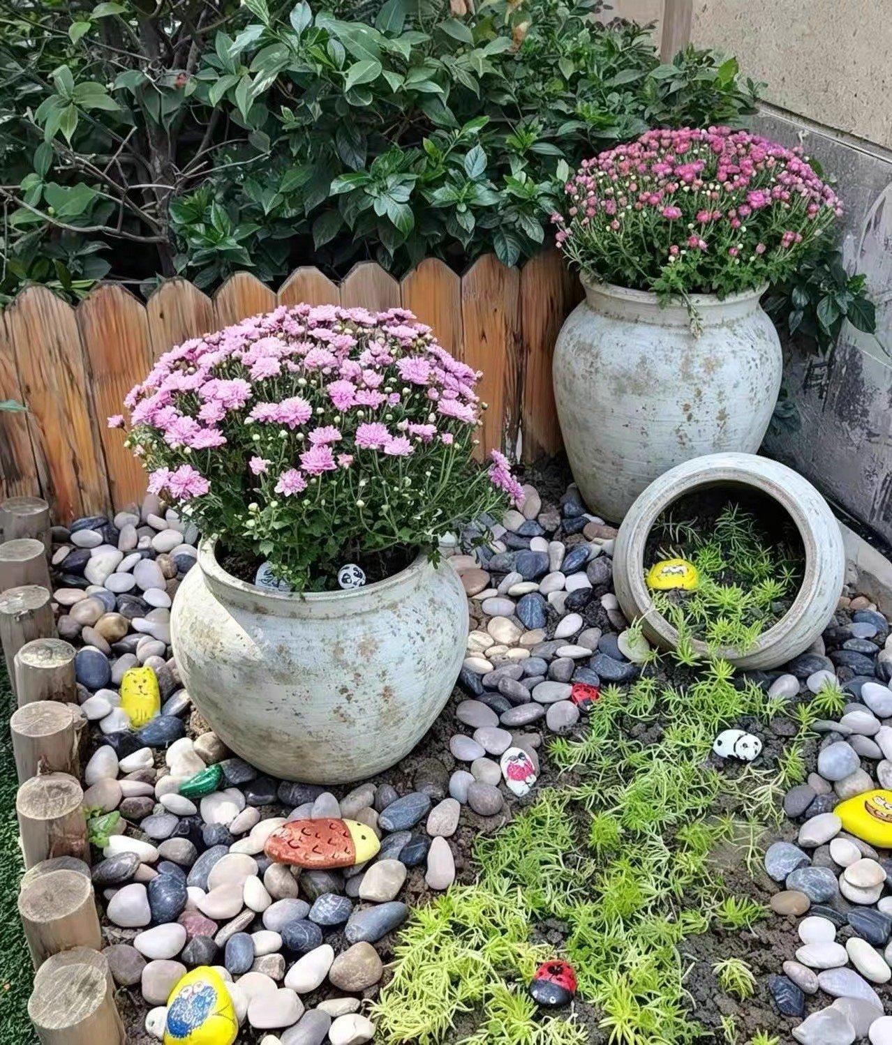 Vintage finish planters in a residential courtyard garden