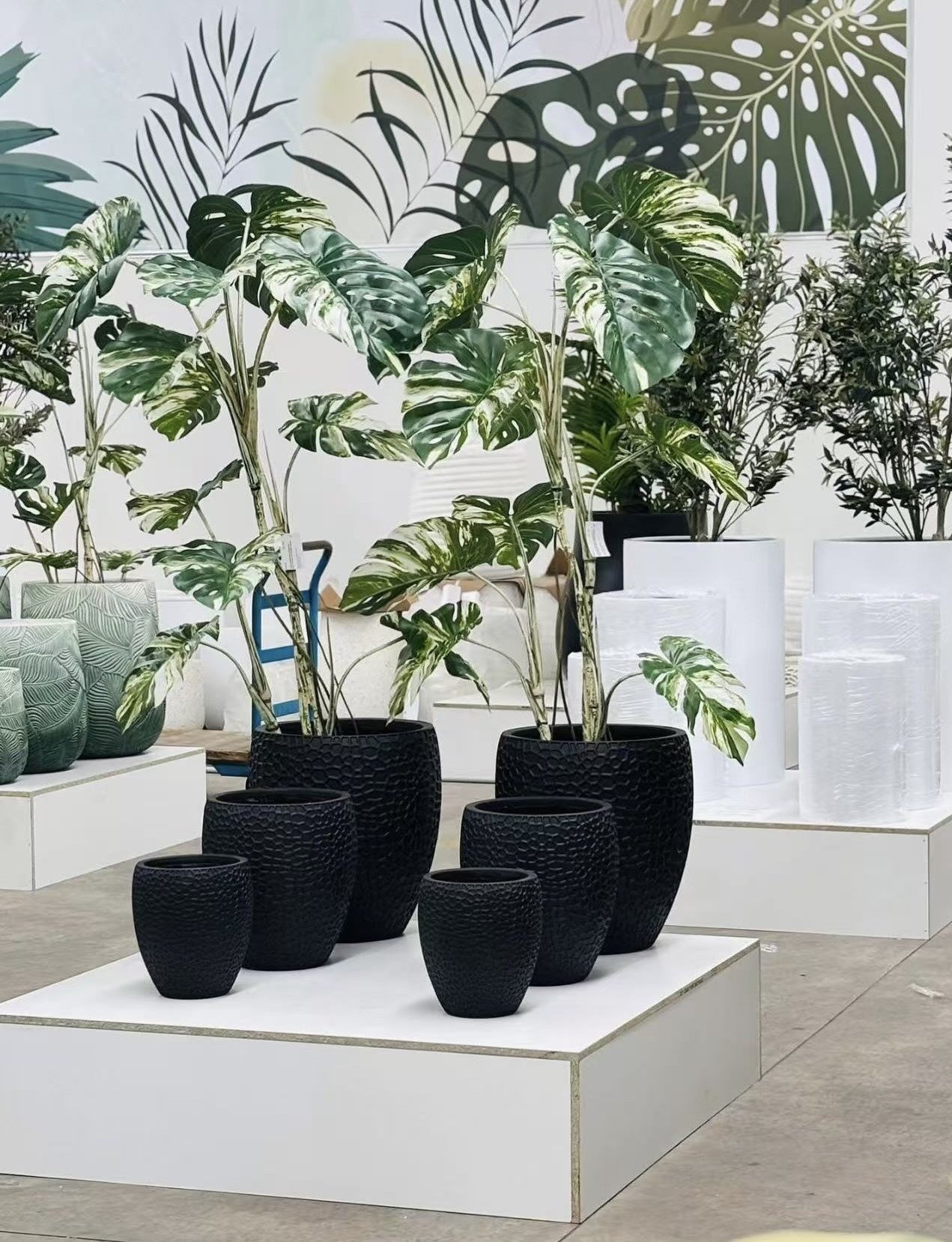 Black magnesium oxide planter sets displayed by a local wholesaler